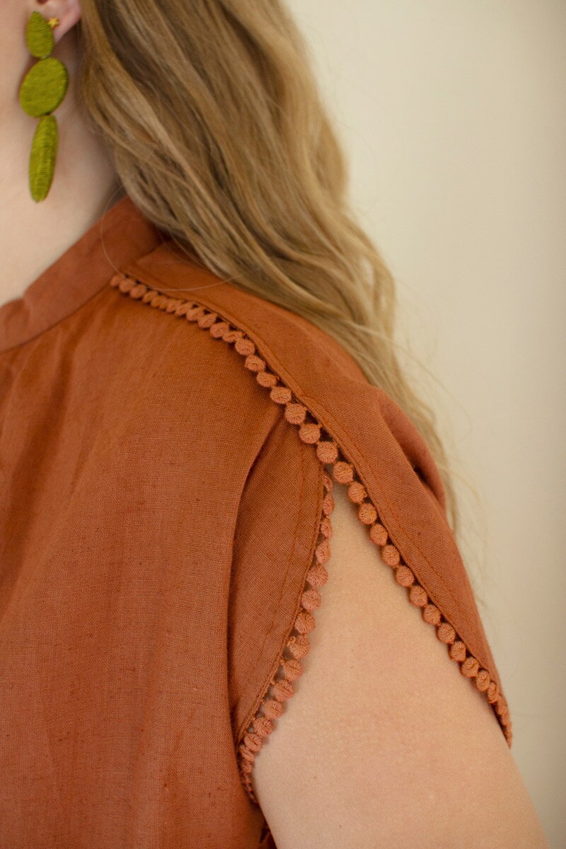Cinnamon High-Neck Shortsleeve Blouse with Flat Pom-Pom Lace Detail