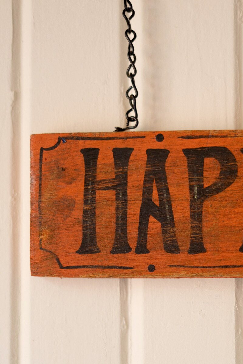 Hand-Hammered Painted Metal Bat with Happy Haunting Sign Wall Hanging
