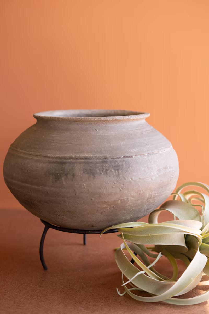 Black Clay Urn on an Iron Stand