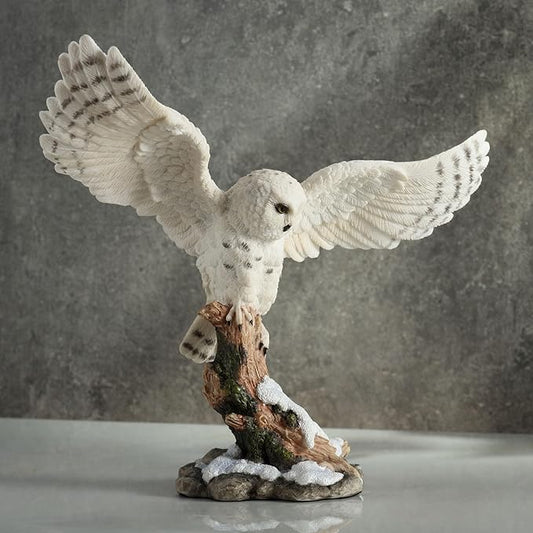 Snowy Owl Spread Wings Perching On Branch