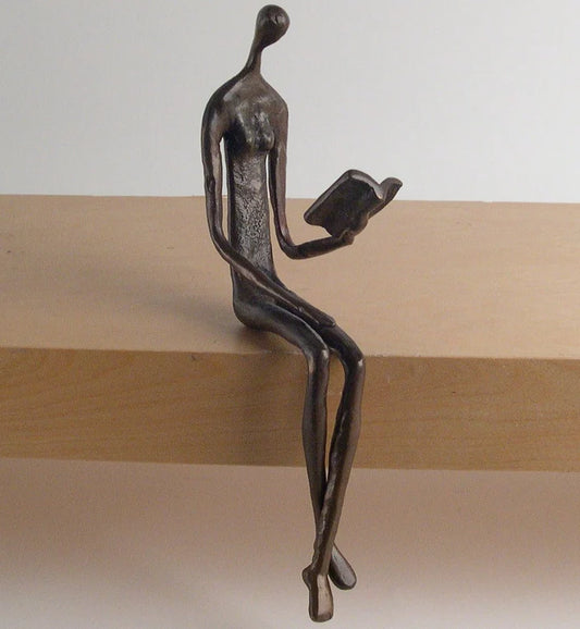 Woman Reading Over Ledge Cast Bronze